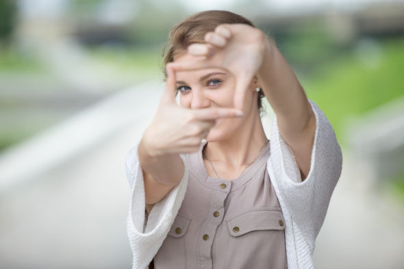 women-pretending-to-take-photo-with-hands