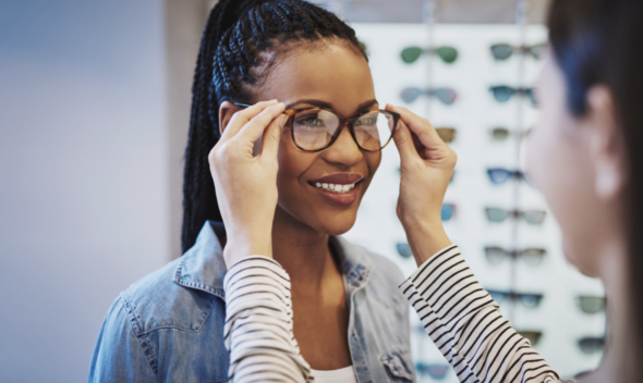 Trying on eyeglasses.